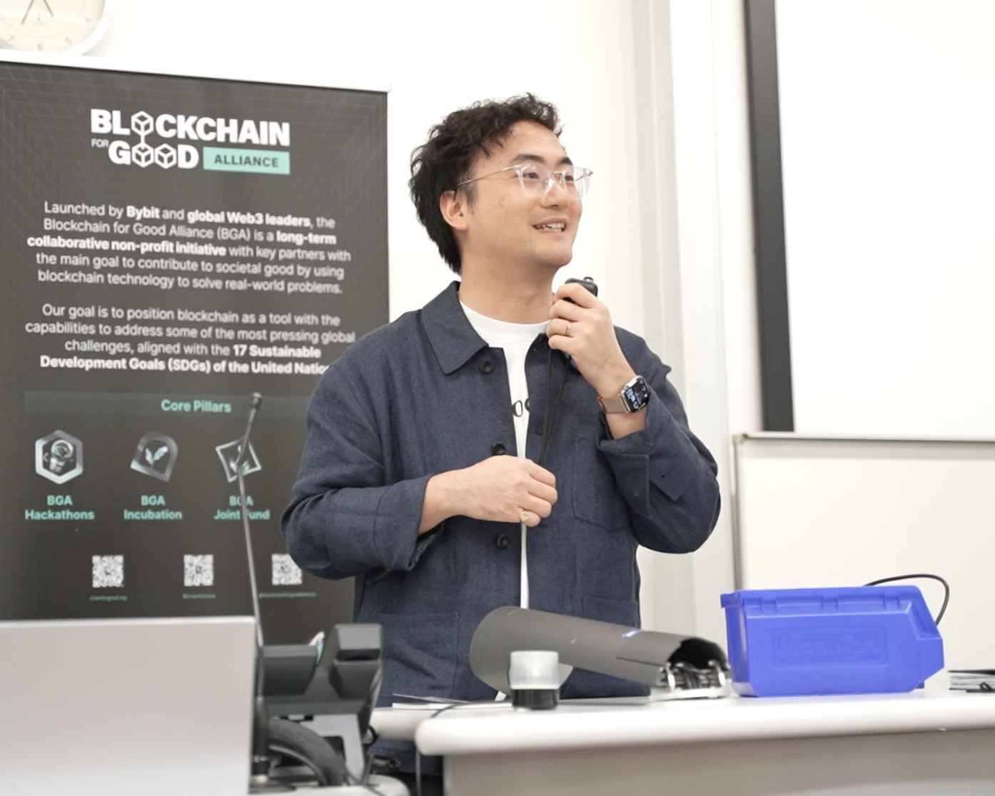 Jiahao Sun with Blockchain for Good Alliance banner