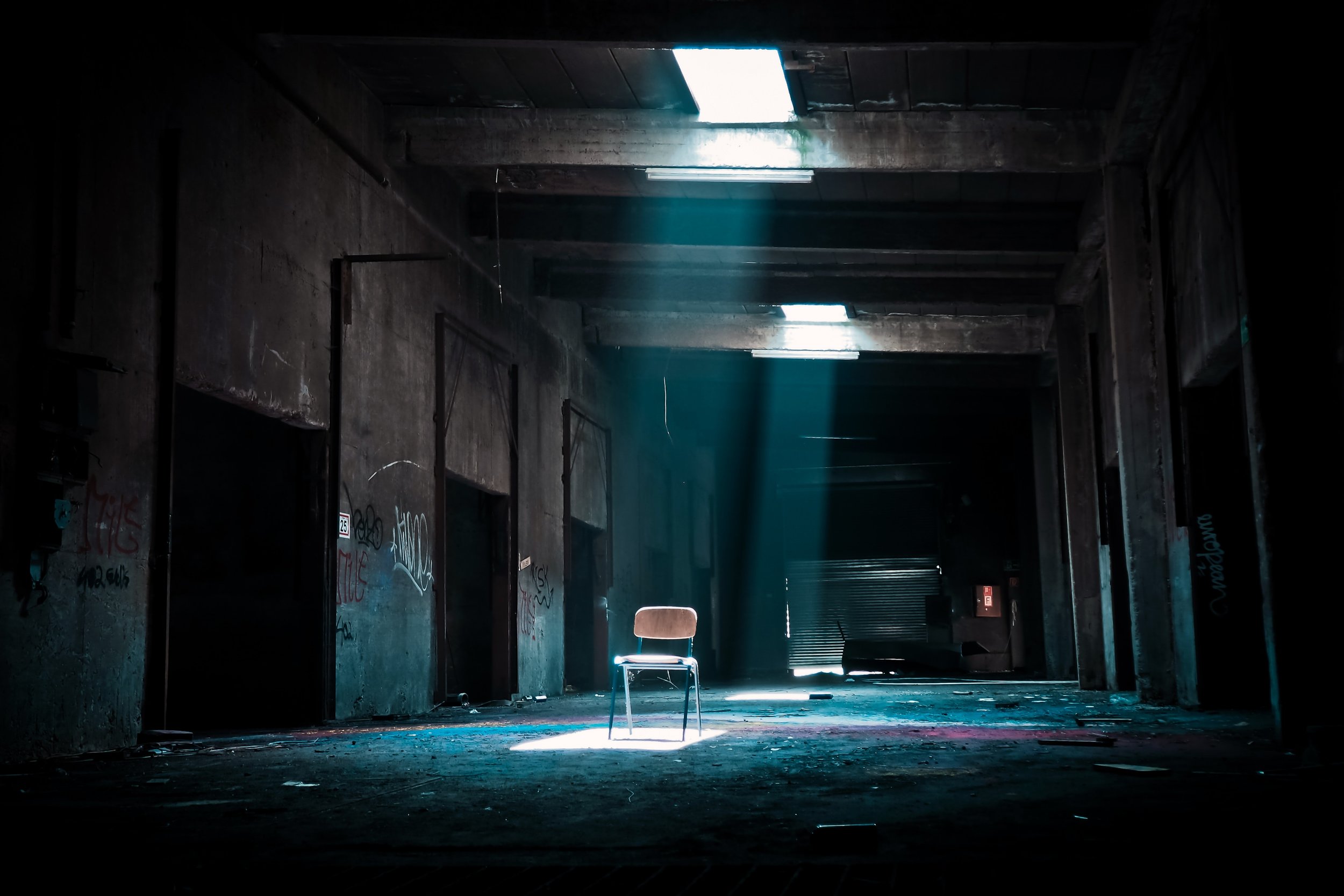 Abandoned Industrial Space — Lone Chair Under Skylight