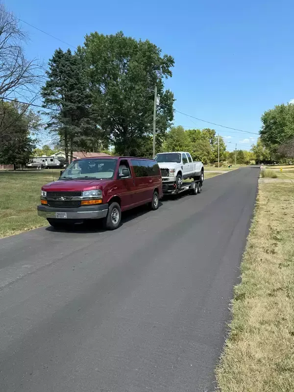 SUV secured with tie-down straps on 7x20 car hauler trailer