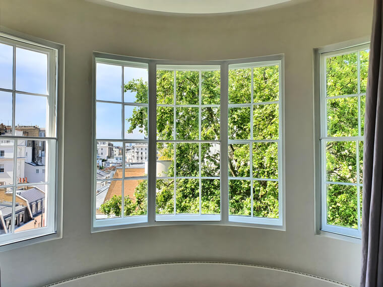 Beautiful curved Regency bow window with secondary glazing in London Regent Park property overlooking mature trees