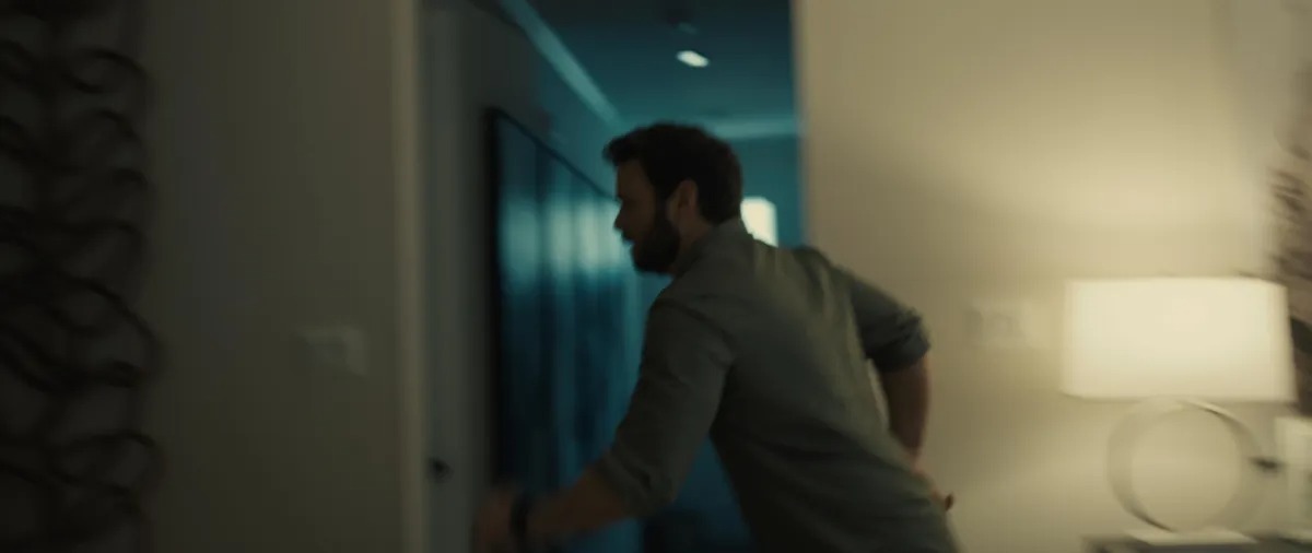 Actor in motion through hallway - cinematic still