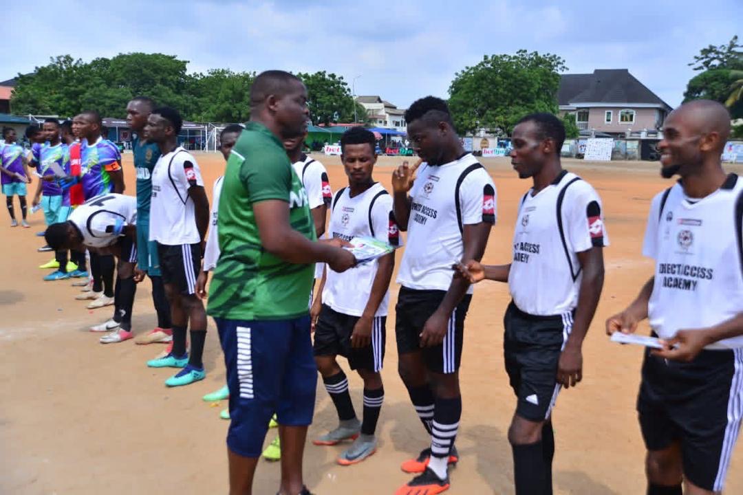 Teams lined up receiving materials from tournament official