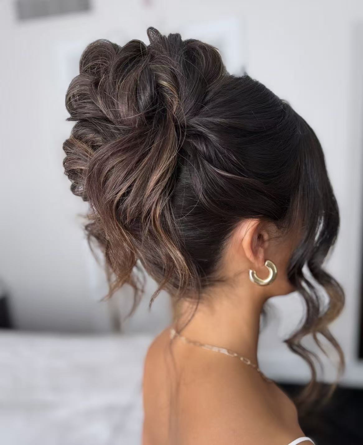 Textured updo hairstyle with loose curls