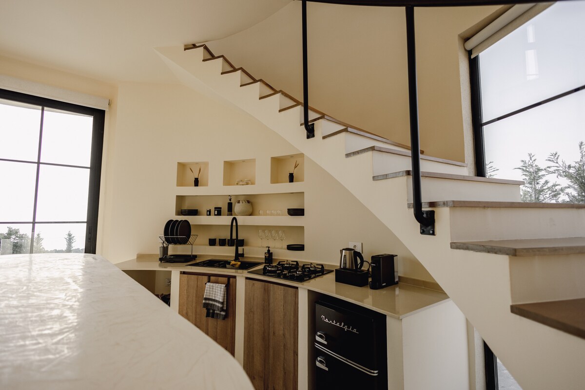Kitchen with curved staircase
