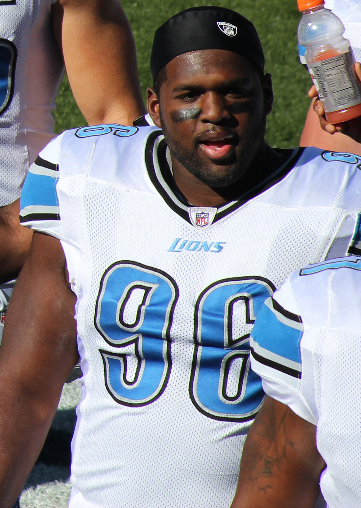 Andre Fluellen in Detroit Lions #96 jersey on the sideline