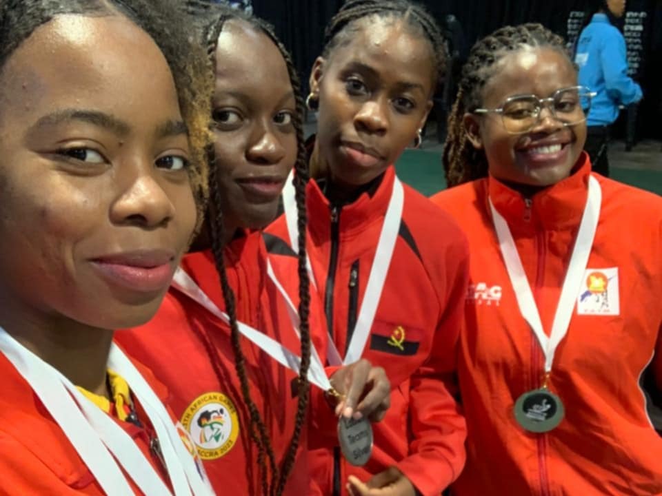 Angola women's table tennis team displaying medals