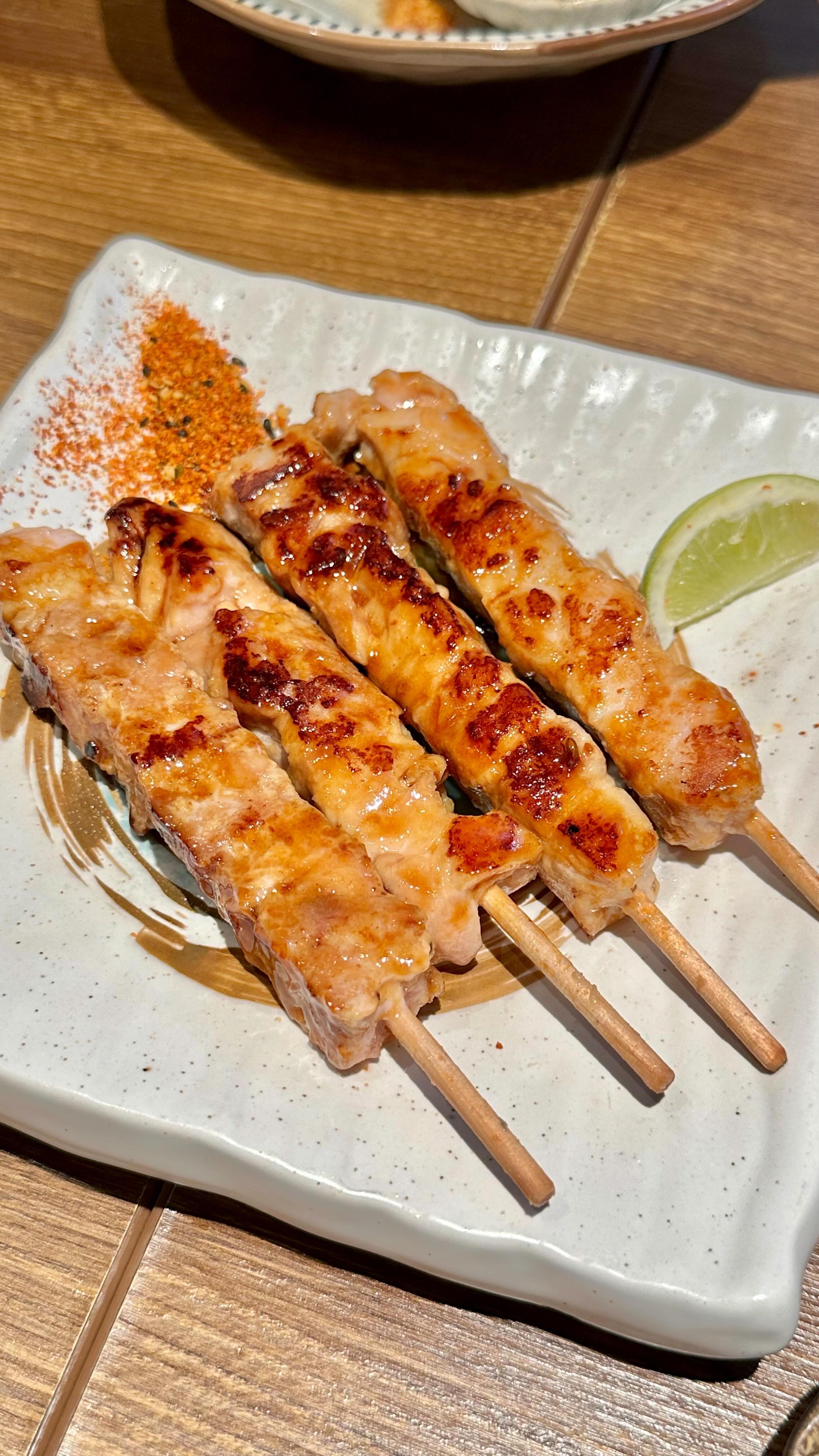 Grilled chicken yakitori skewers served with lime at UMAYA World Square