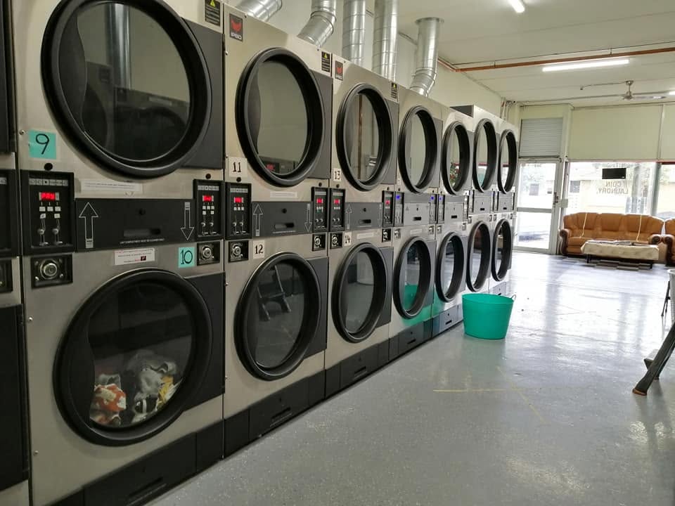 Rows of numbered self-service dryers ready for walk-in customers