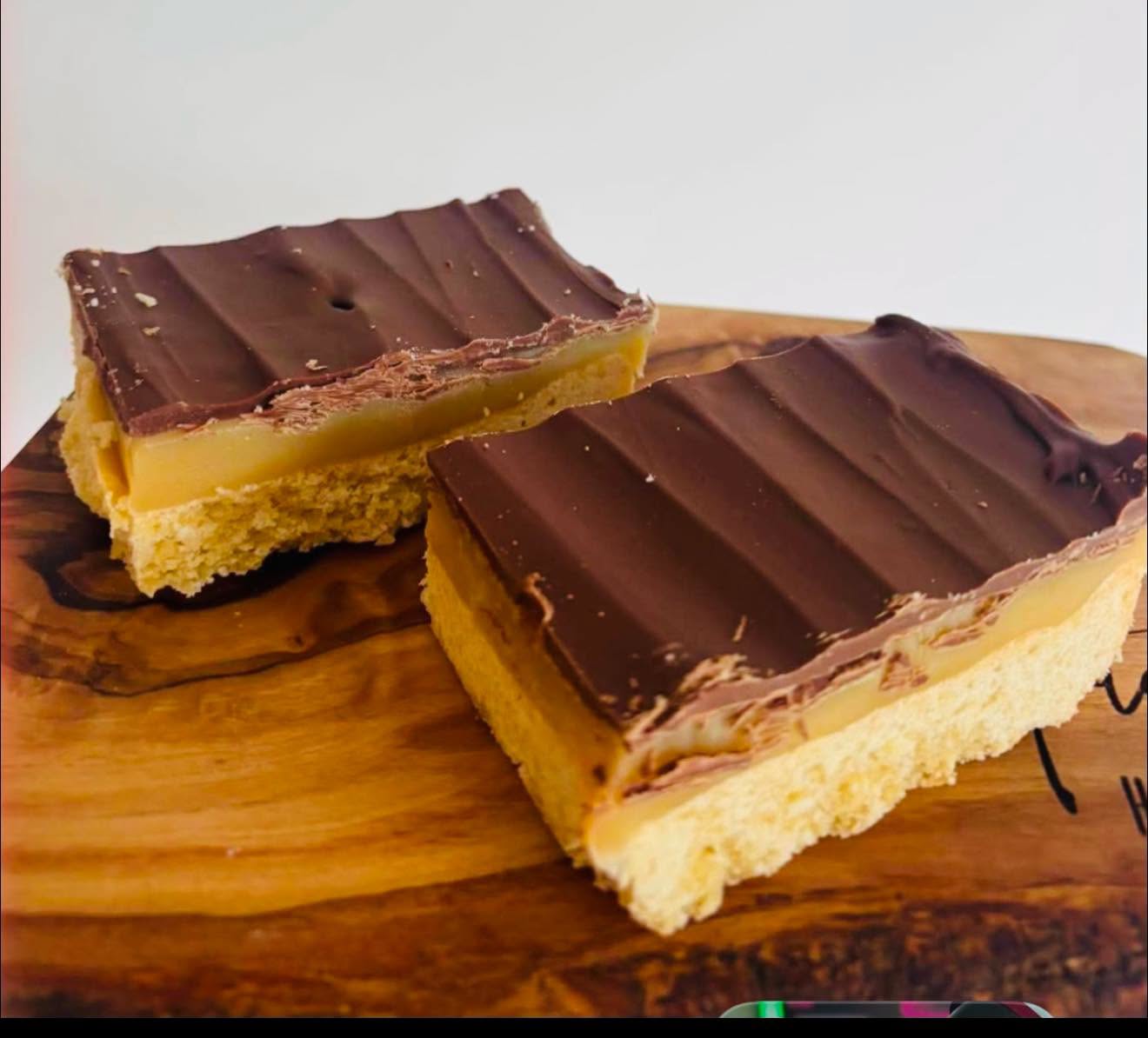 Homemade caramel slice on a wooden serving board — Jiji Bistro fresh kitchen baking