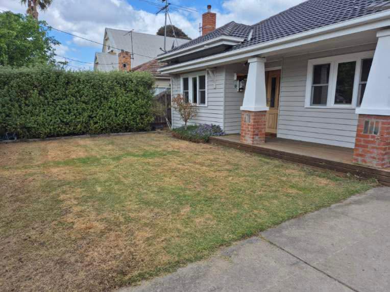 Landscaping and concrete path alongside residential home