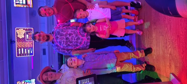 Church families gathered together for a fellowship night at the bowling alley
