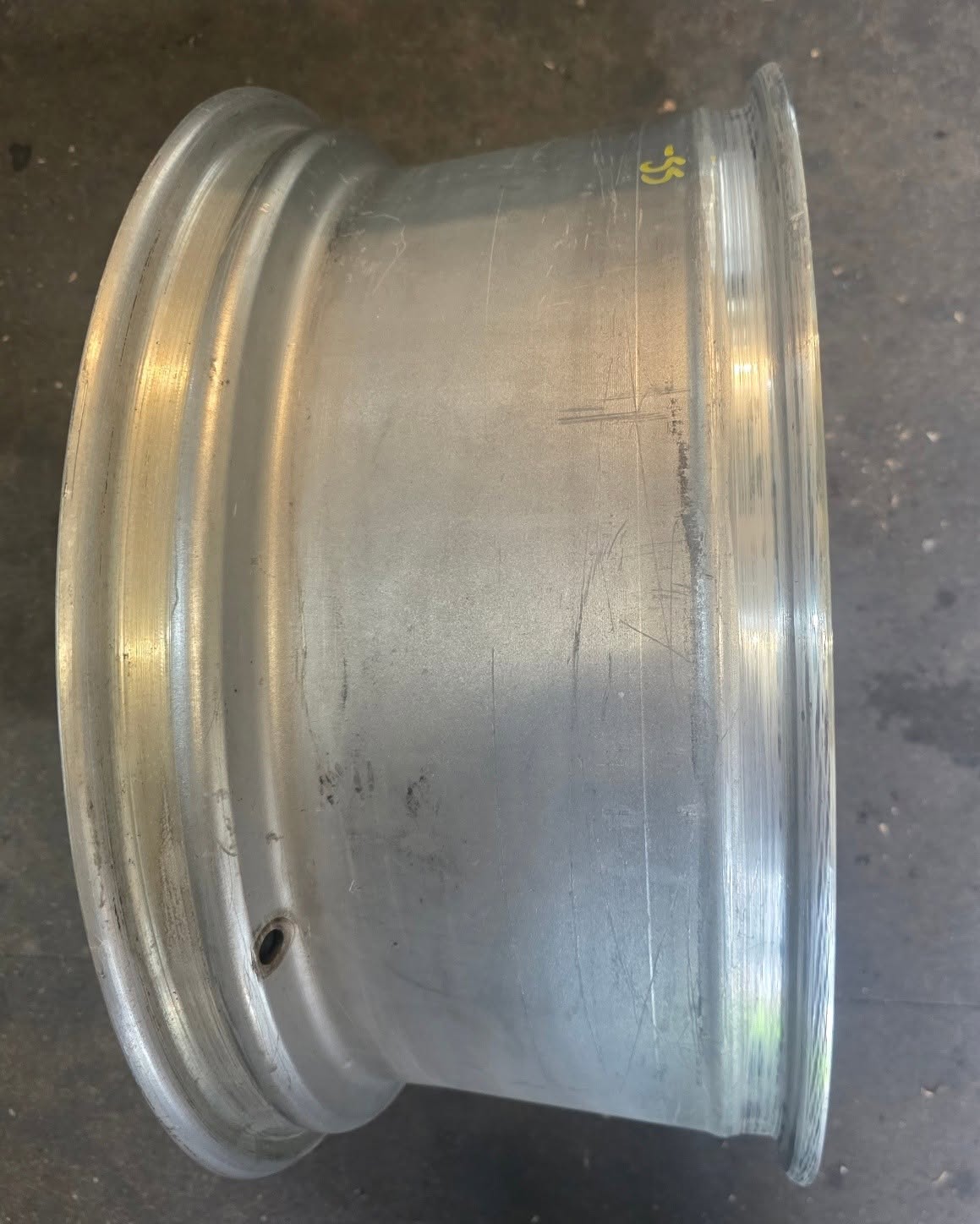 Alloy wheel with polished barrel surface ready for refurbishment
