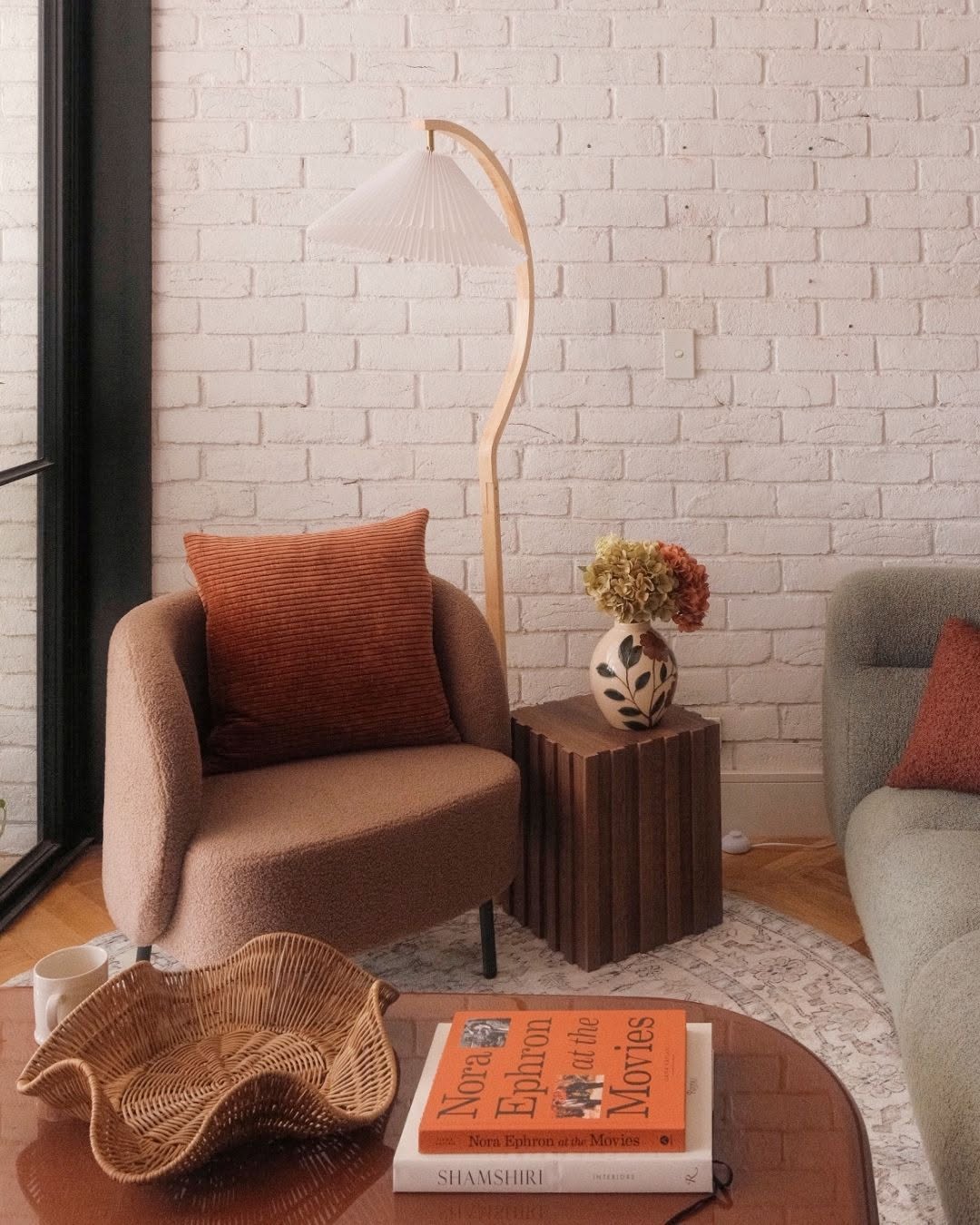 Cosy living room with armchair and decorative lamp, representing Red Dollar's home lifestyle range