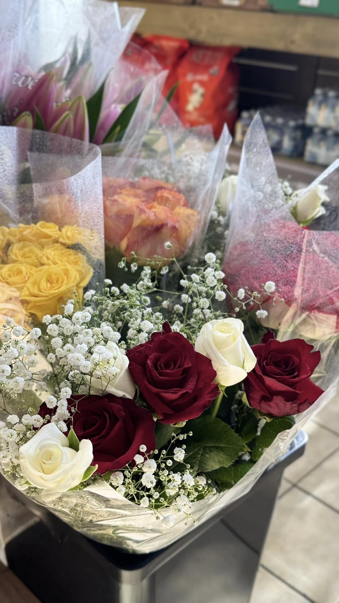 Red, white and yellow rose bouquets with baby's breath