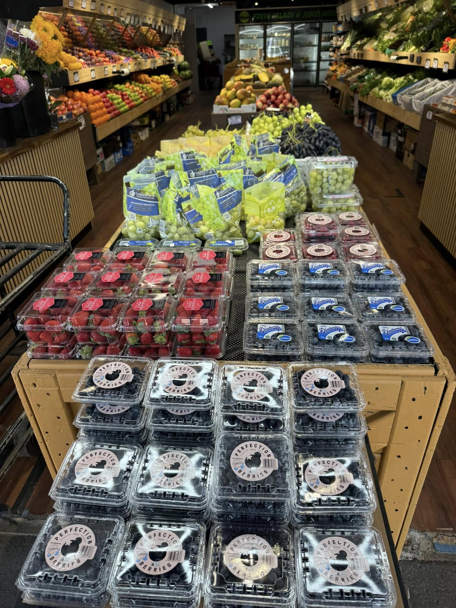 Colourful fresh berries and grapes displayed inside Passion For Produce, Bentleigh East