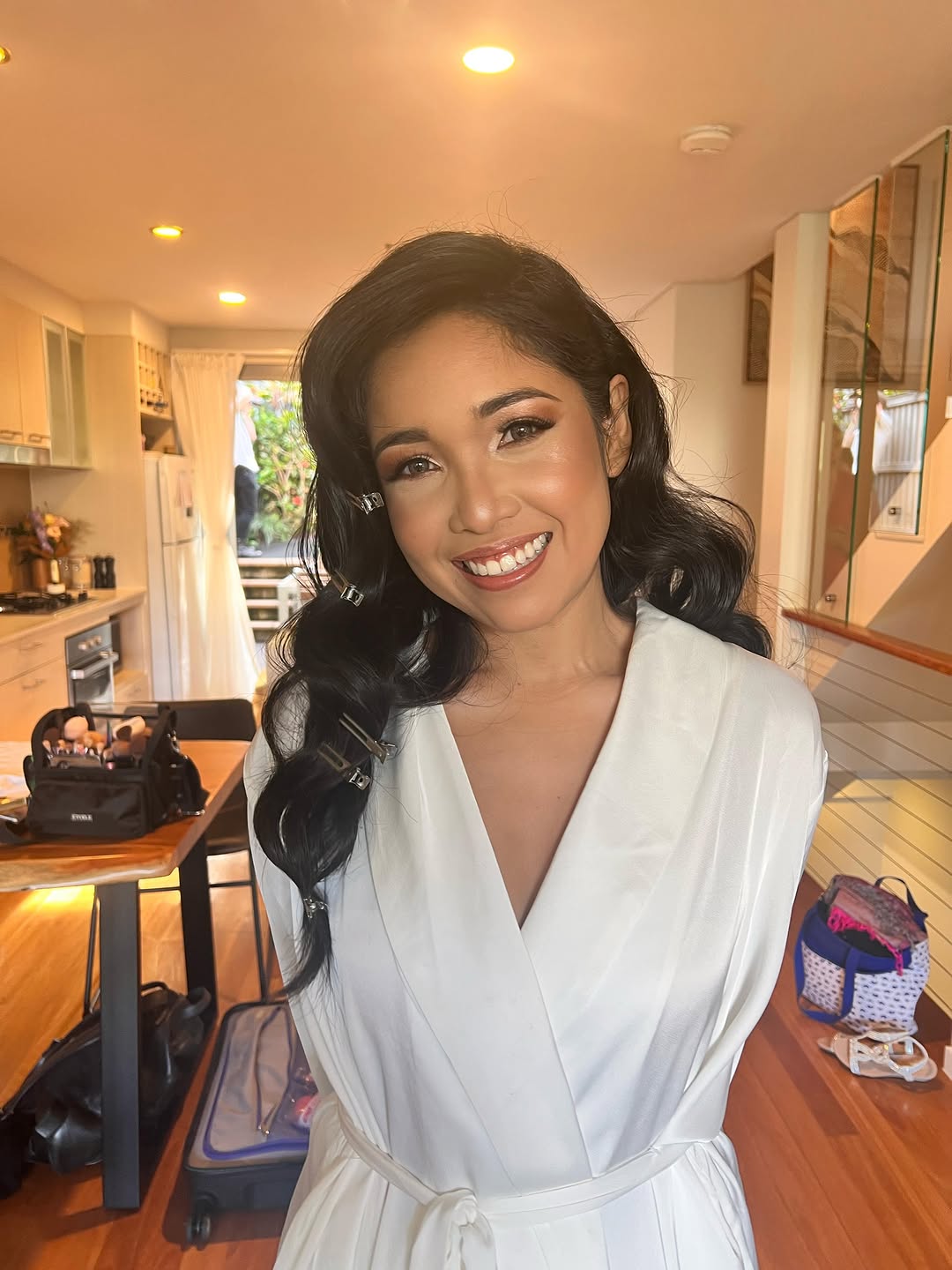 Bridal hair styling — dark wavy curls with hair clips