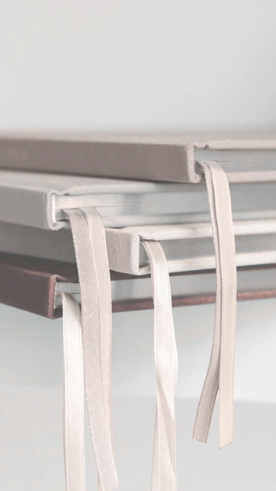 Bound client planning folders with ribbon detail, reflecting a traditional approach to financial documentation