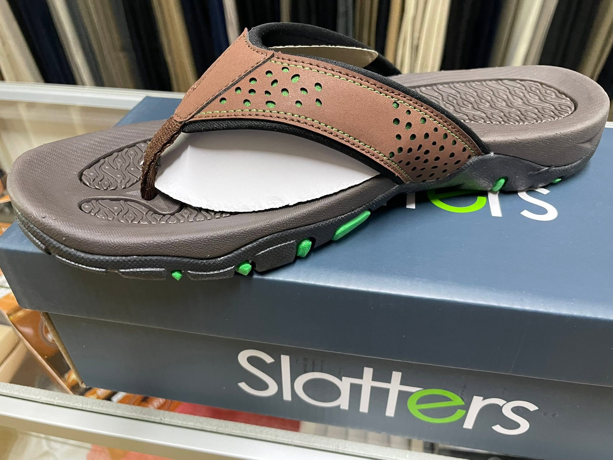Brown sandal with a cushioned sole on display