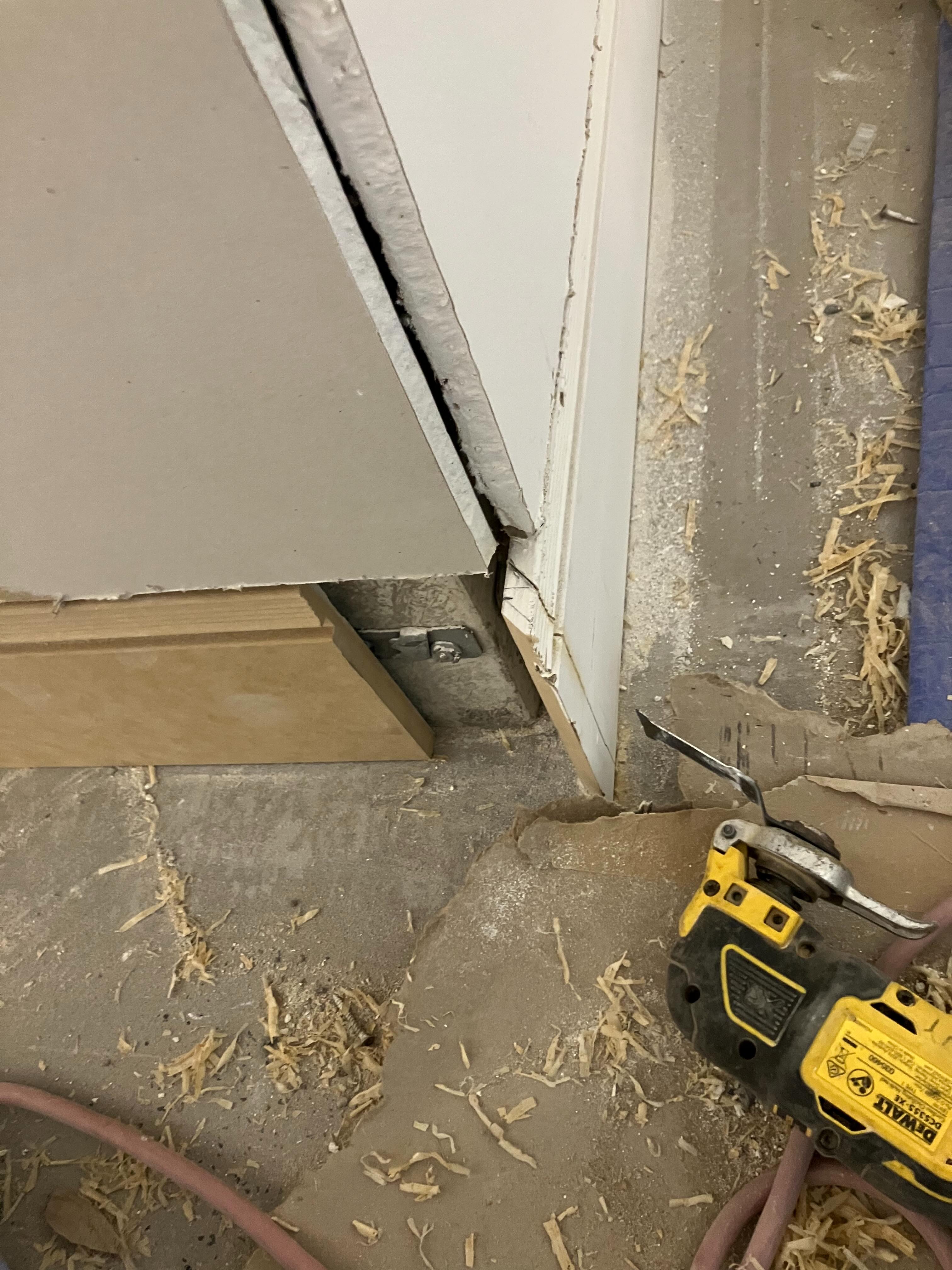 Detail of a door frame installation with building tools nearby