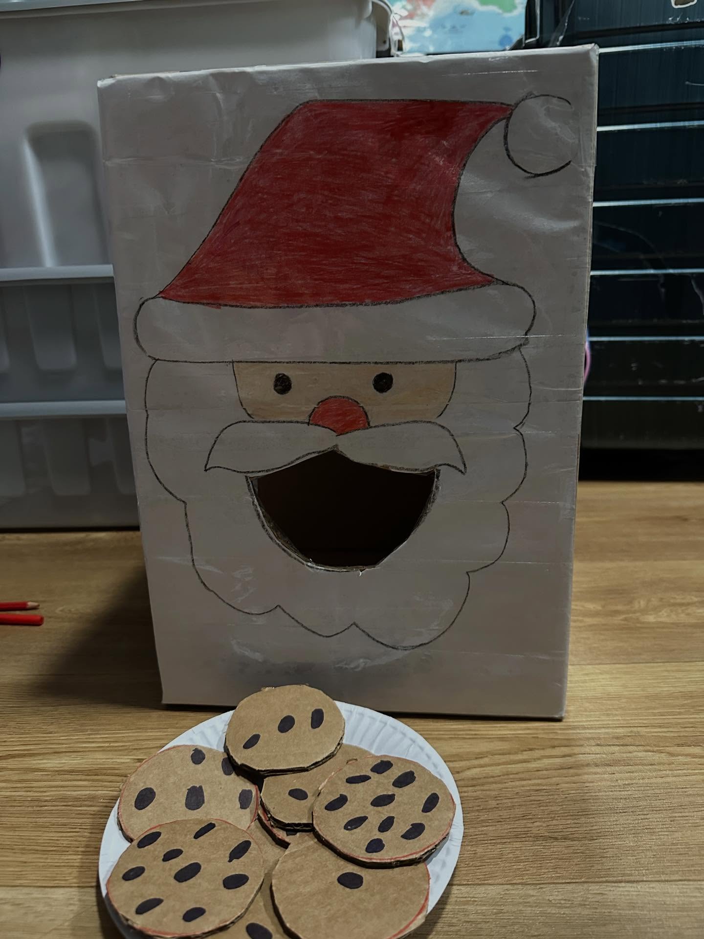 Handmade Santa craft with cardboard cookies — festive arts activity