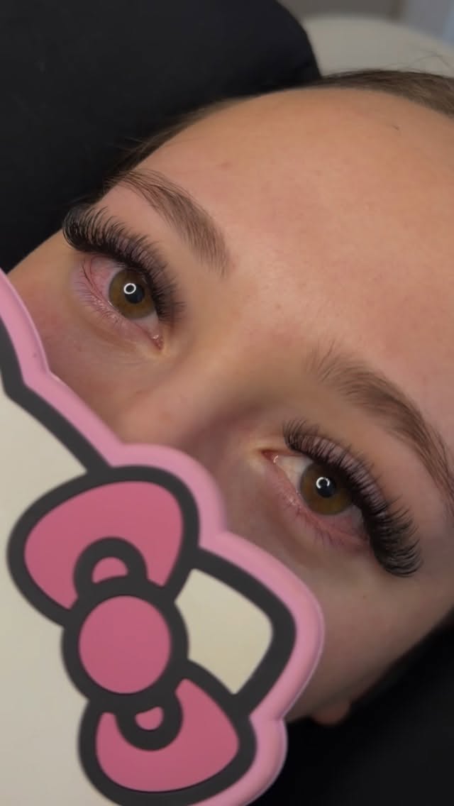 Close-up of blue eyes showing clean, well-maintained lash extensions