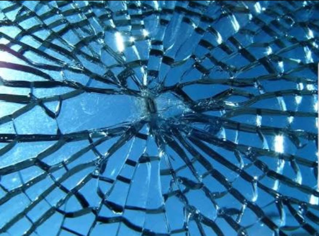 Shattered glass close-up — Challenge Glass repairs all types of glass