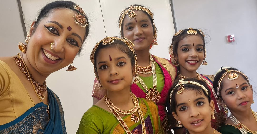 Dance teacher with young students dressed in Bharatanatyam costume at Natyanjali School of Dance
