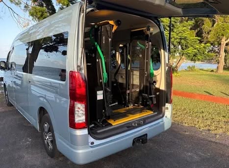 Wheelchair-accessible maxi taxi van with ramp lowered, ready for accessible passenger transport in Perth