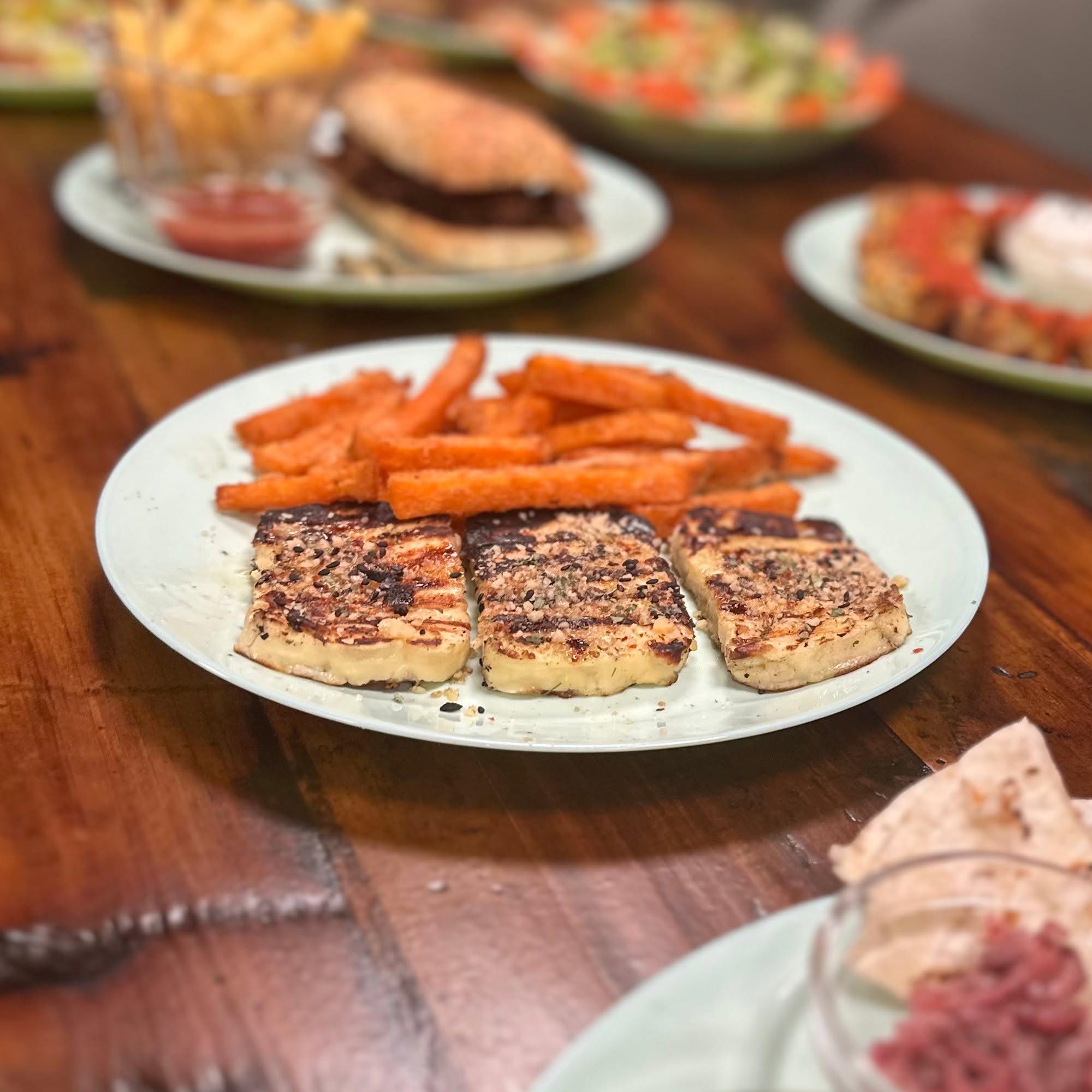 Grilled slices with a golden crust served with orange chips