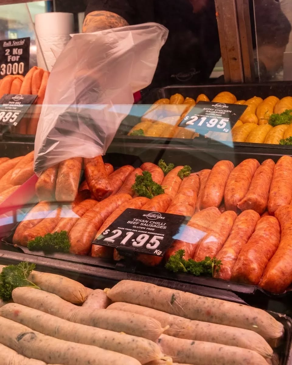 Display cabinet full of colourful house-made sausages including Texan Chilli Beef and Satay Chicken varieties