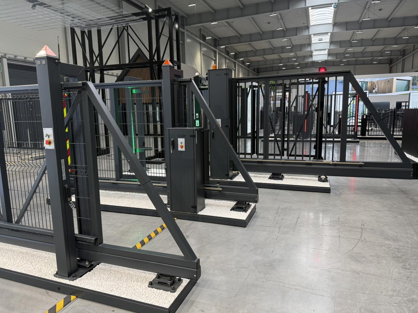 Modern steel automated gates and barriers in a showroom