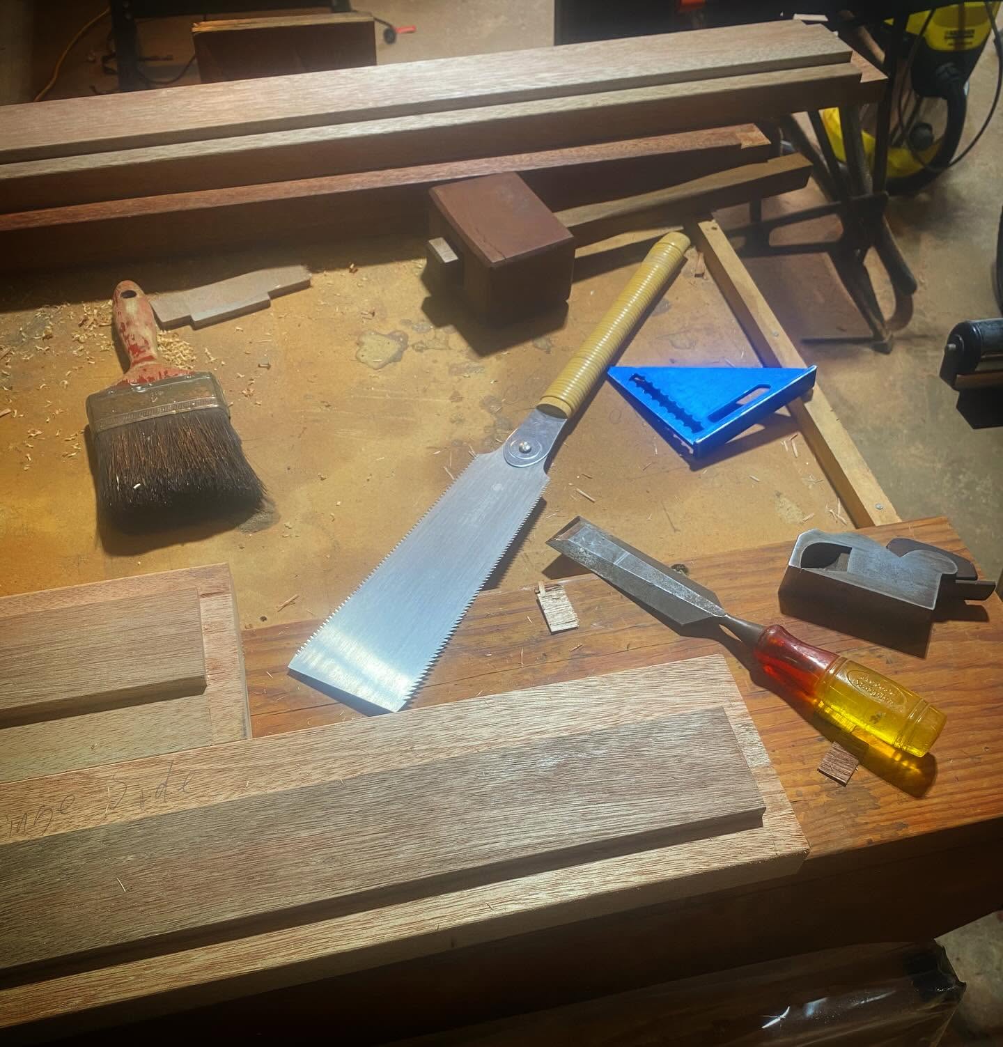 Carpenter's workbench with hand saw, chisels and tools