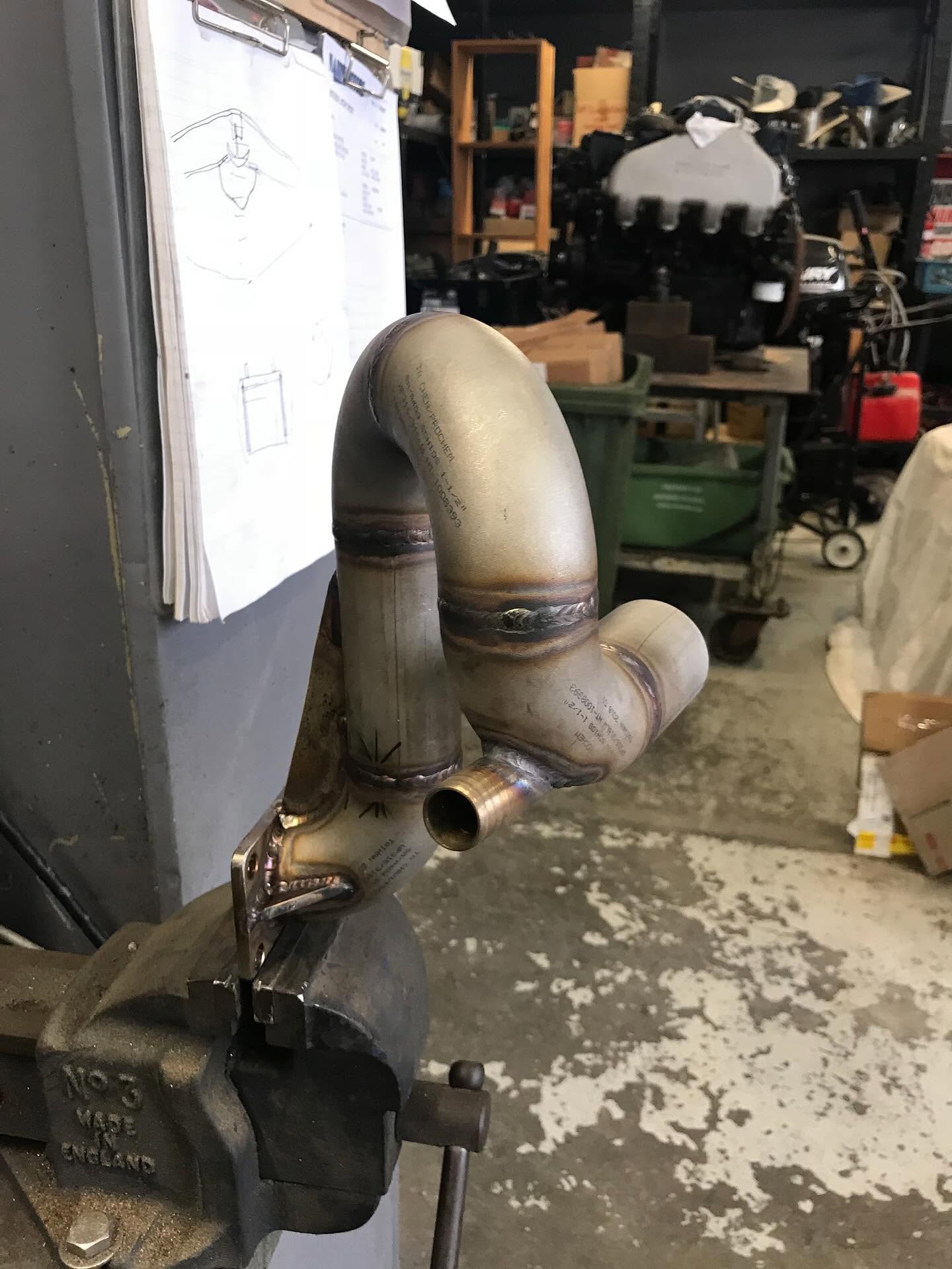 Custom TIG-welded stainless steel exhaust pipe bend fabricated at LJP Industries