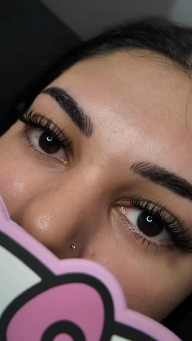 Close-up of beautiful lash extensions on brown eyes — lash supplies quality