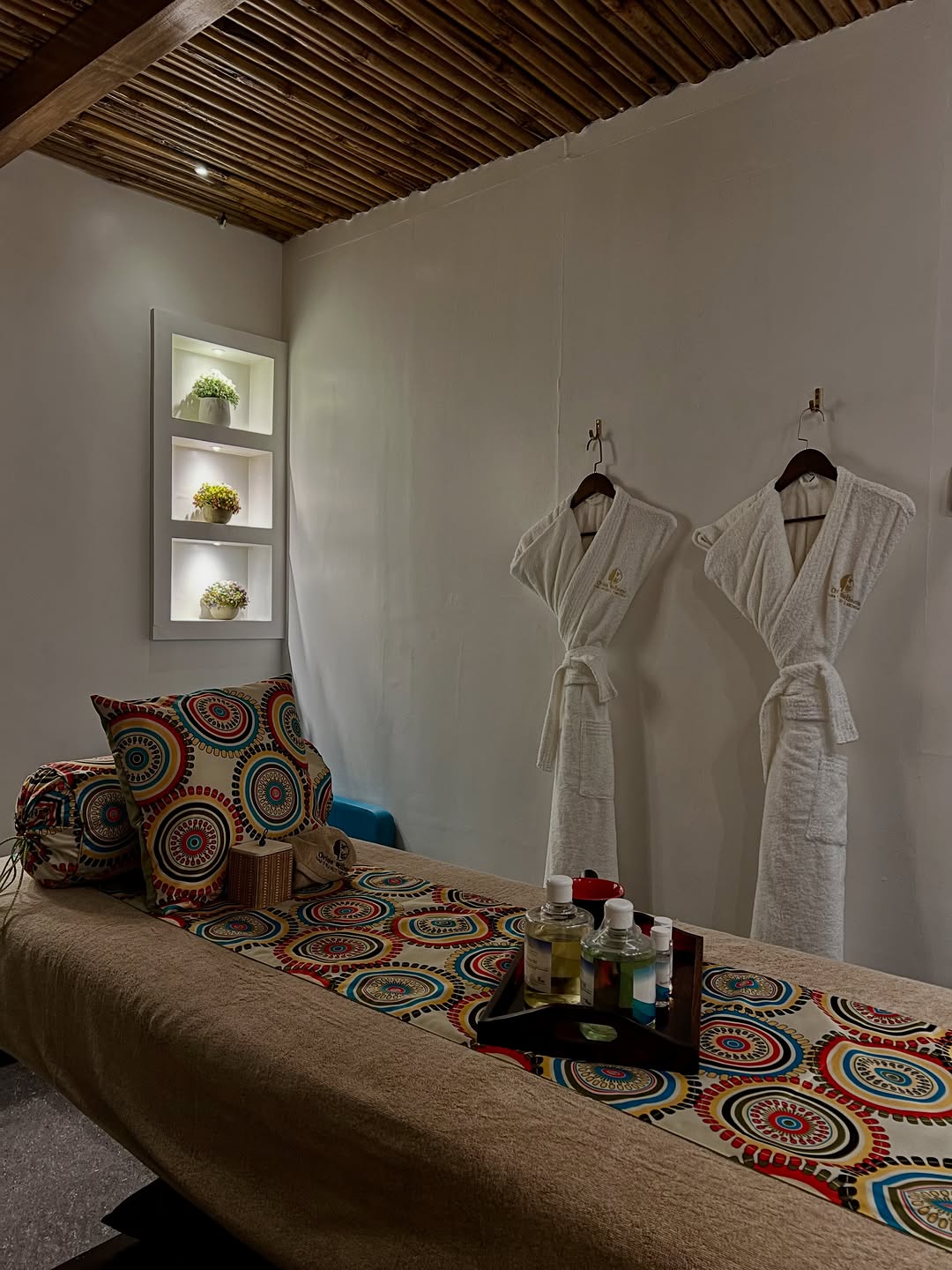 Peaceful massage treatment room at Orion Massage Centre with prepared table and robes