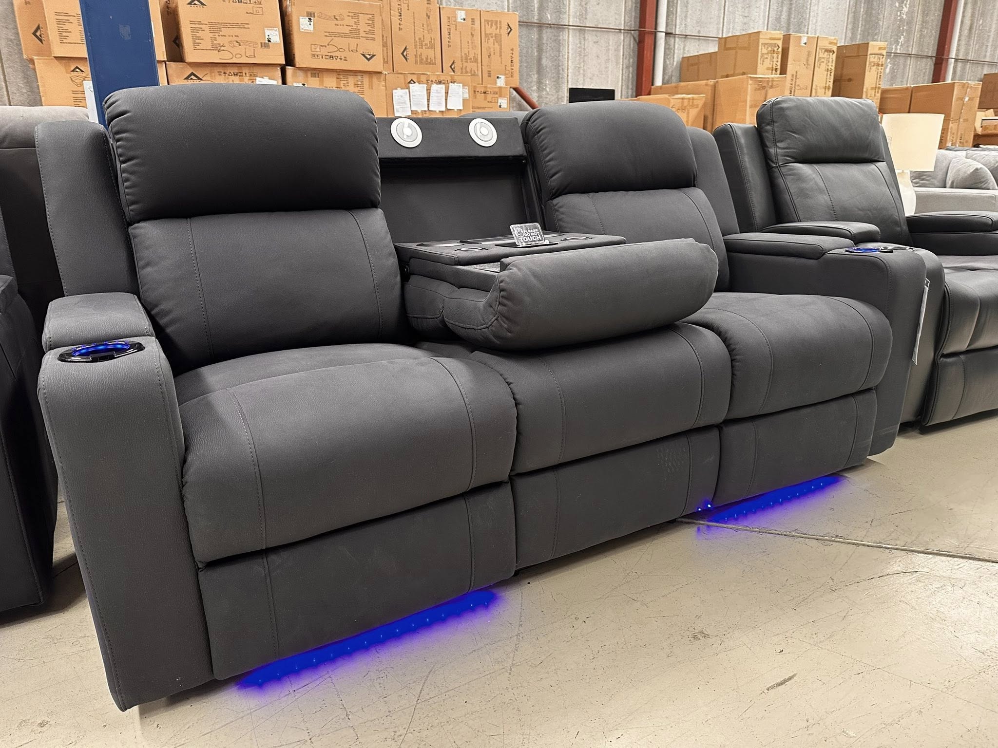 Charcoal fabric recliner sofa with a fold-down console and cup holders