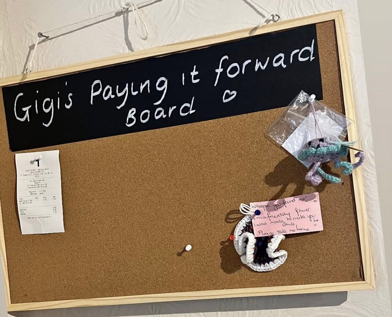 Gigi's Paying it Forward Board — a cork board where community members can pay for a meal or drink for someone in need