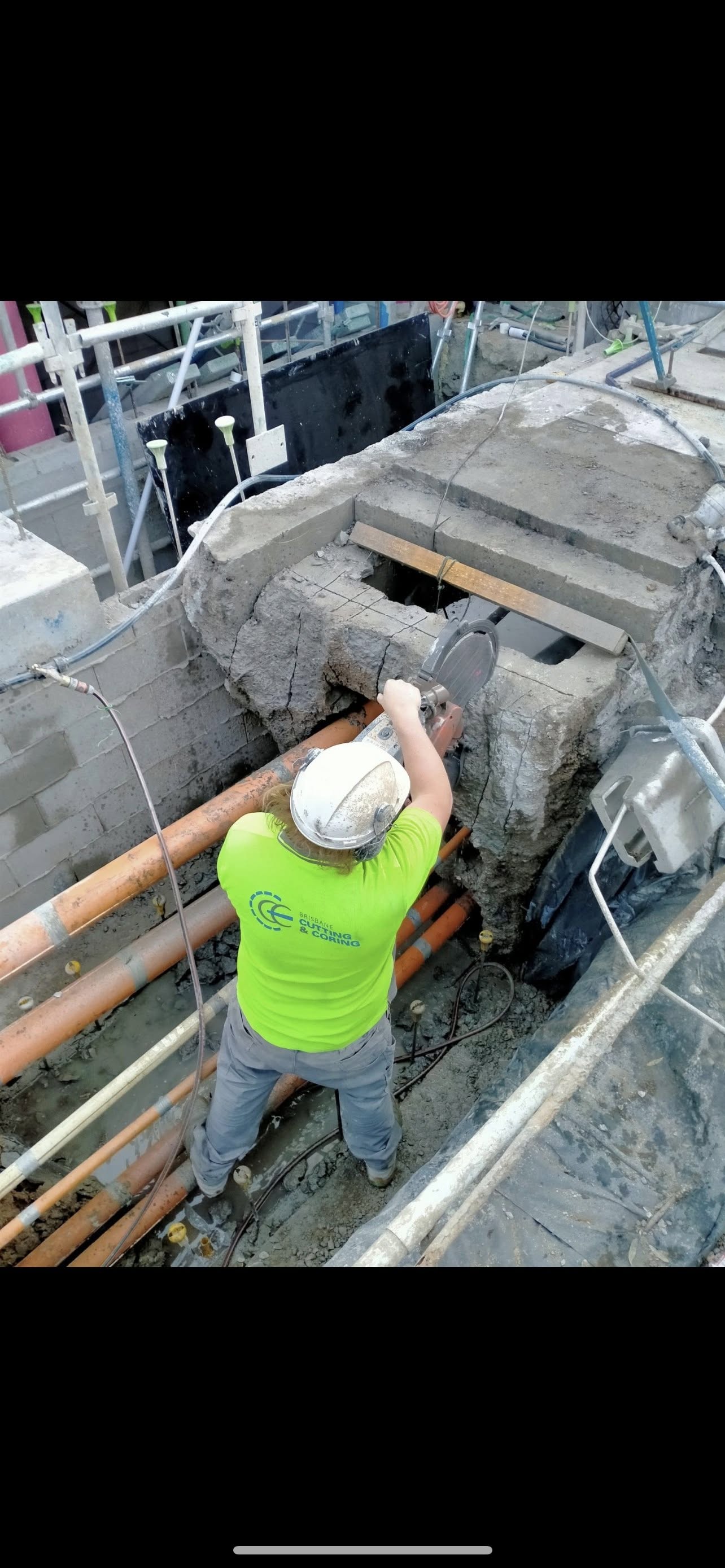 Concrete cutting and coring work in progress on a construction site