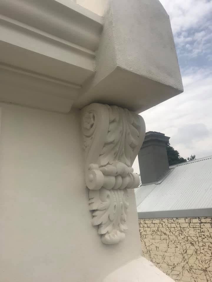 Ornate white plaster corbel bracket detail — high-quality plastering by Primo Property Maintenance