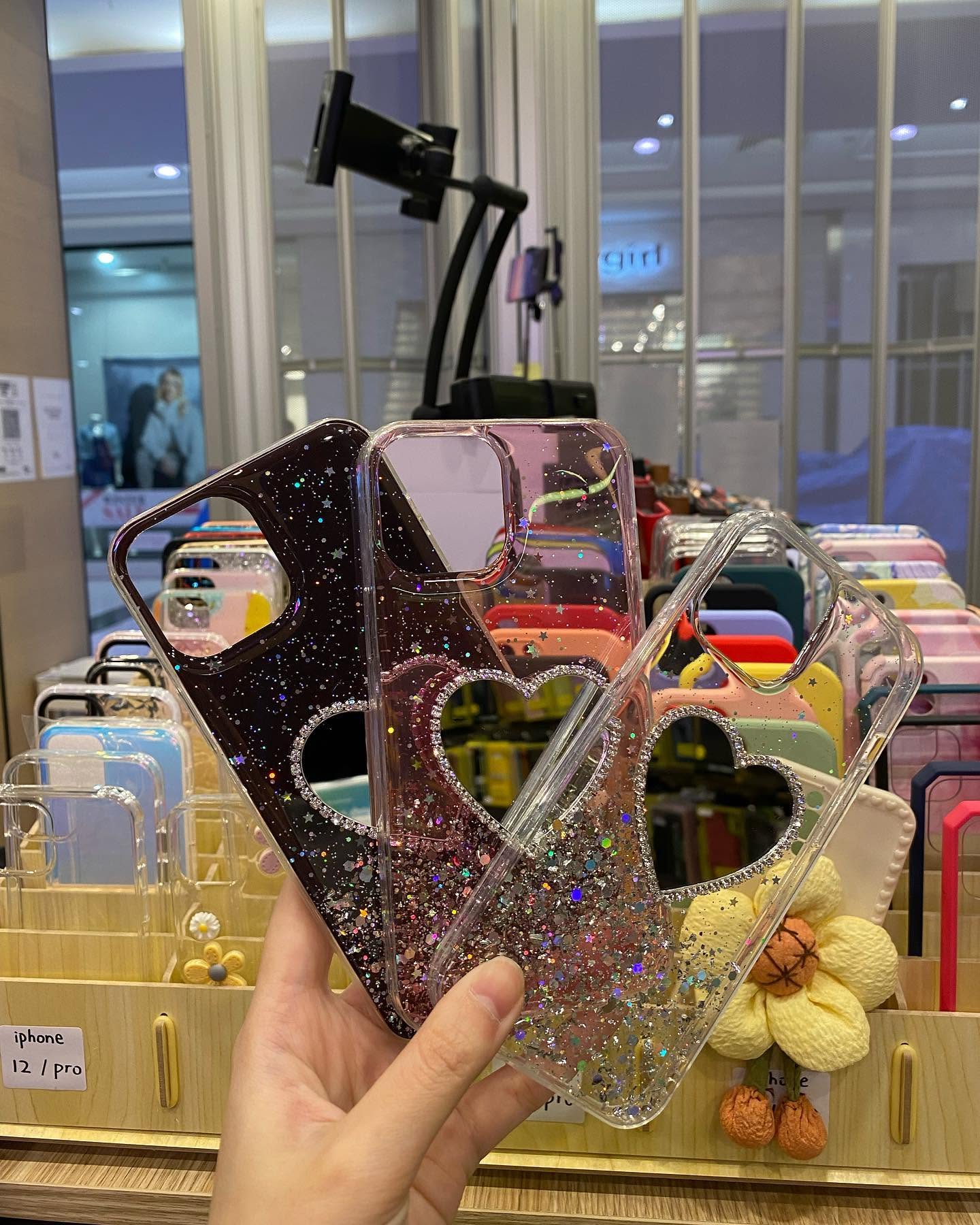 Large wall display of packaged data cables and chargers in the Pimp My Mobile store