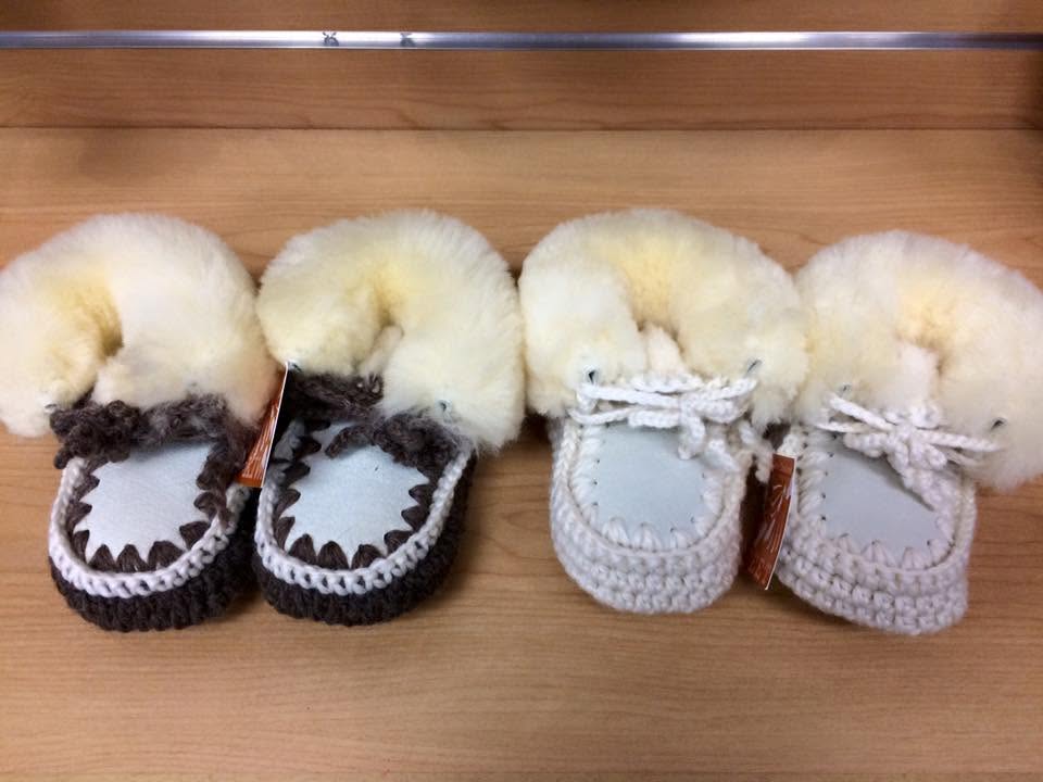 Handcrafted sheepskin baby booties — a popular Australian souvenir available in-store