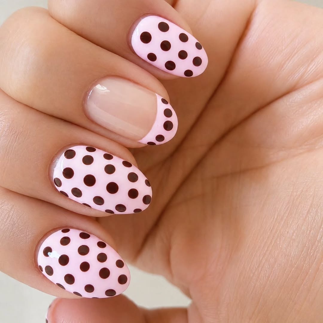 Soft pink nails with brown polka dot nail art