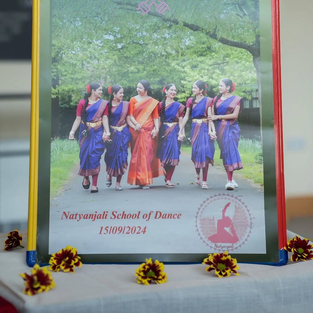 Natyanjali School of Dance event program featuring dancers walking outdoors in traditional costumes