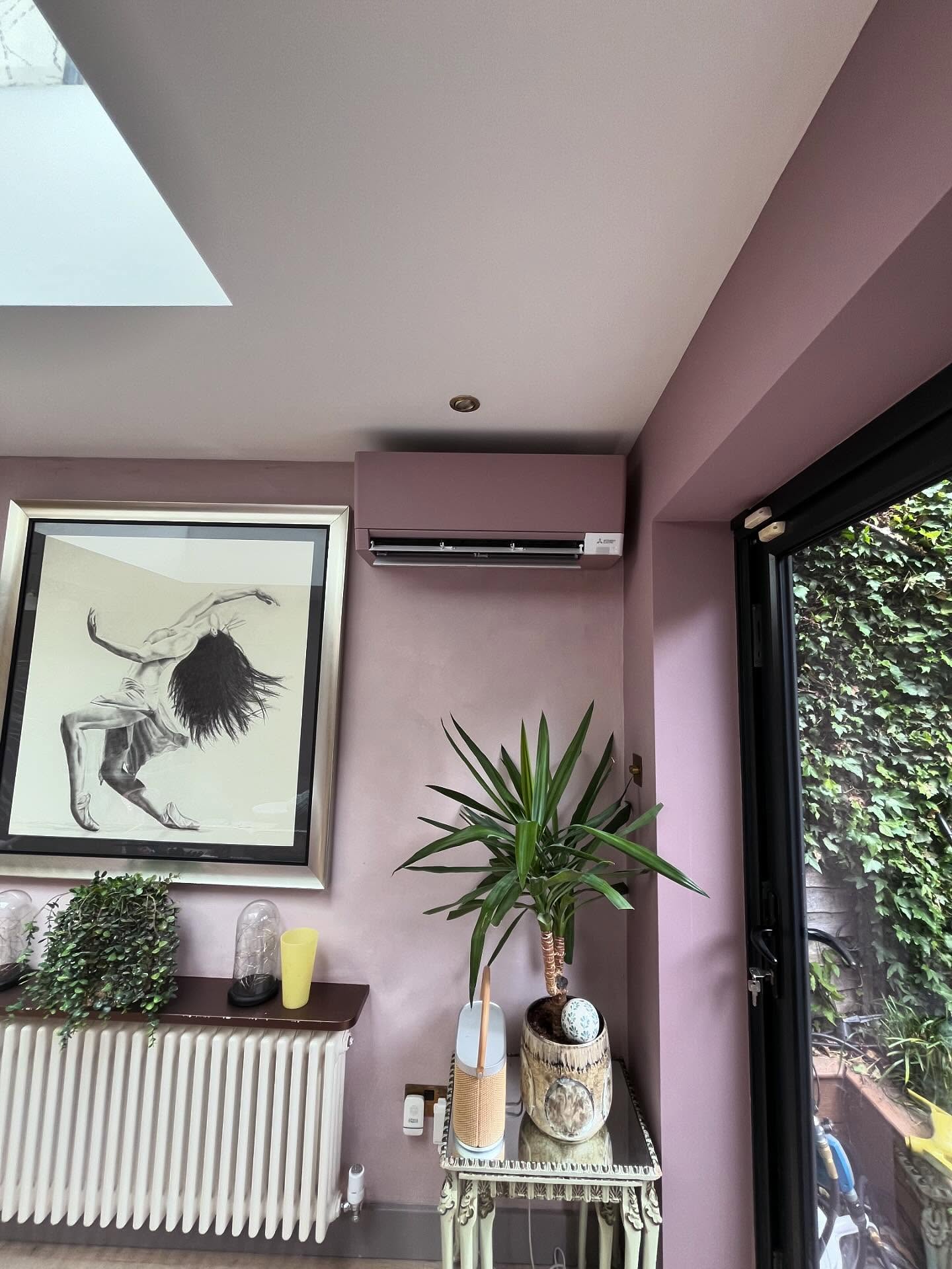 Professionally installed wall-mounted split system air conditioner in a modern home