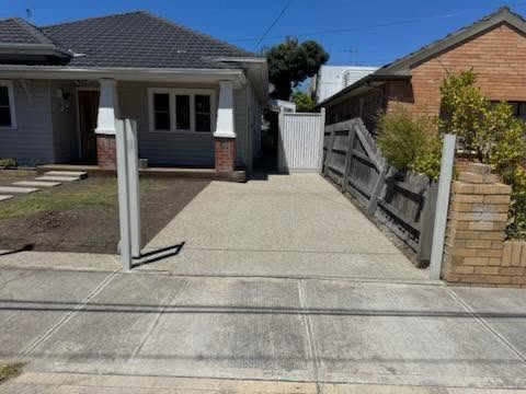 Exposed aggregate driveway installation by Benjamin's Concreting