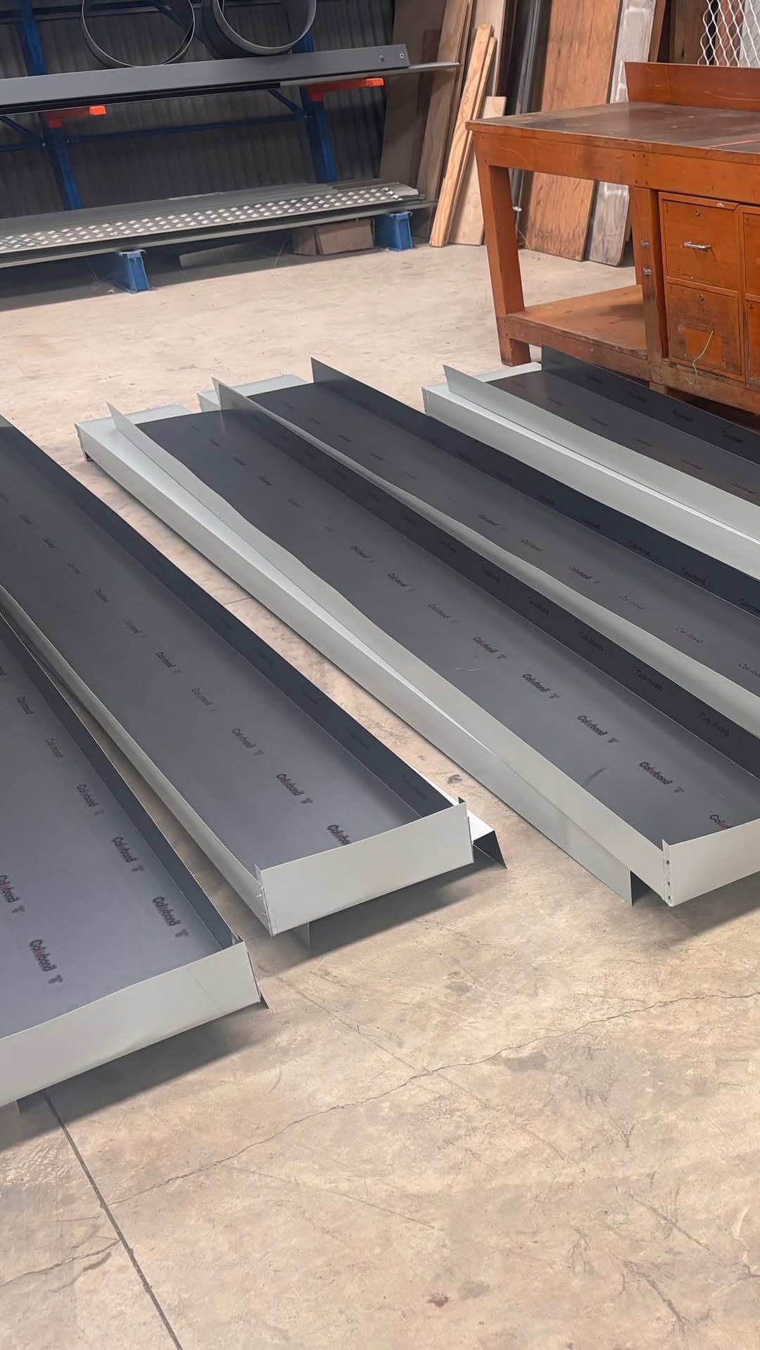 Close-up view of standing seam metal roof cladding installed on a modern building
