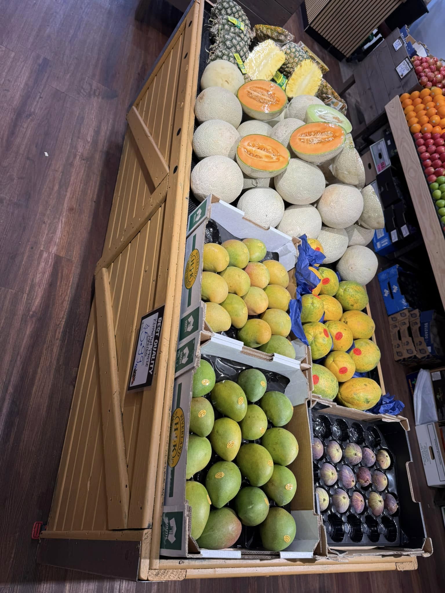 Cantaloupes, mangoes and tropical fruits displayed at Passion For Produce