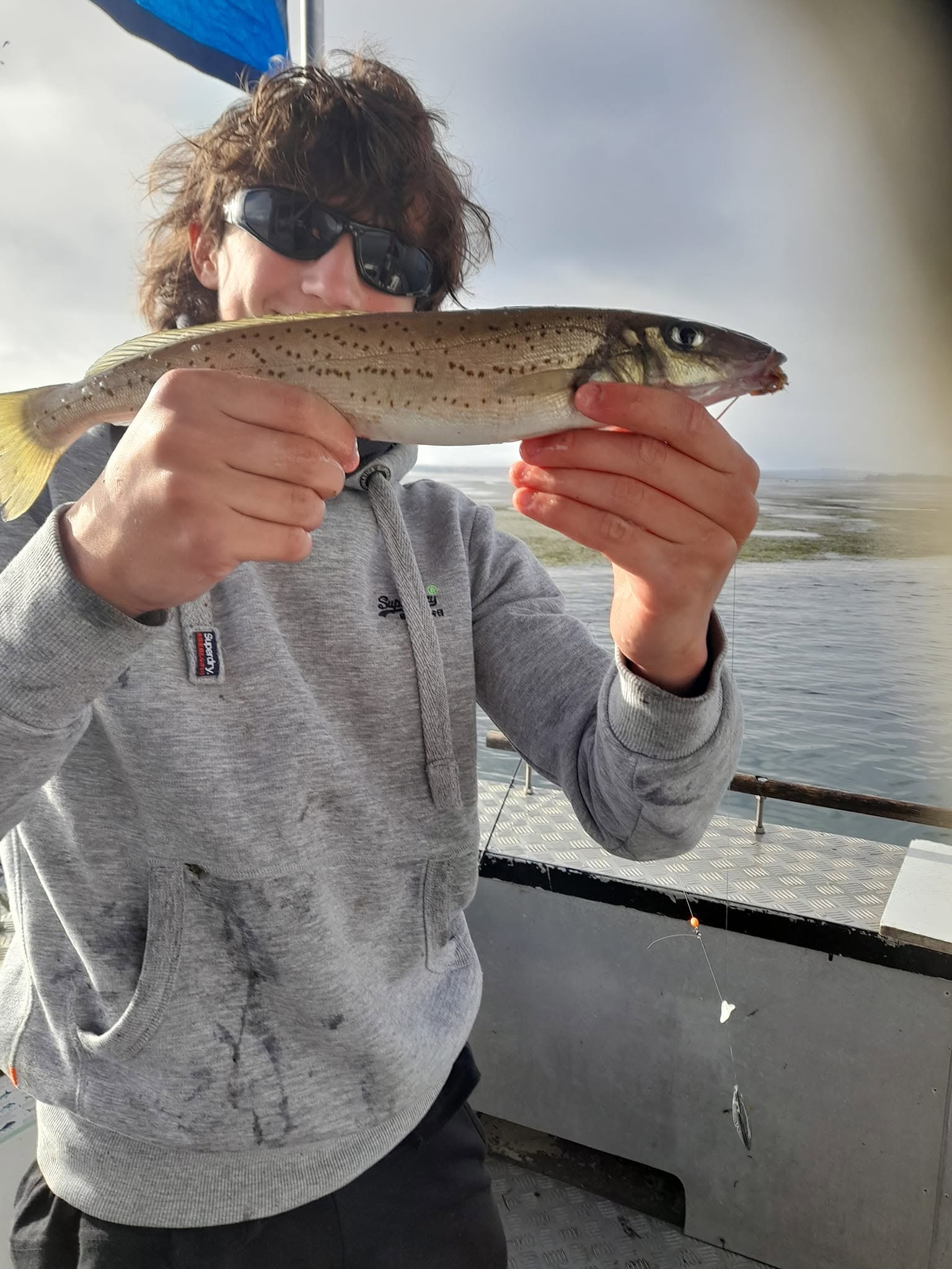 Angler holding a King George whiting caught from the charter boat on Western Port Bay