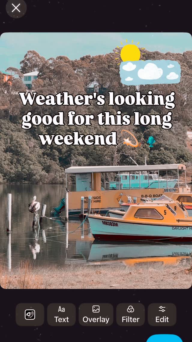 Portside Boat Hire fleet moored at Lakes Entrance — boats numbered 5 and 9 visible with the BBQ boat in the background