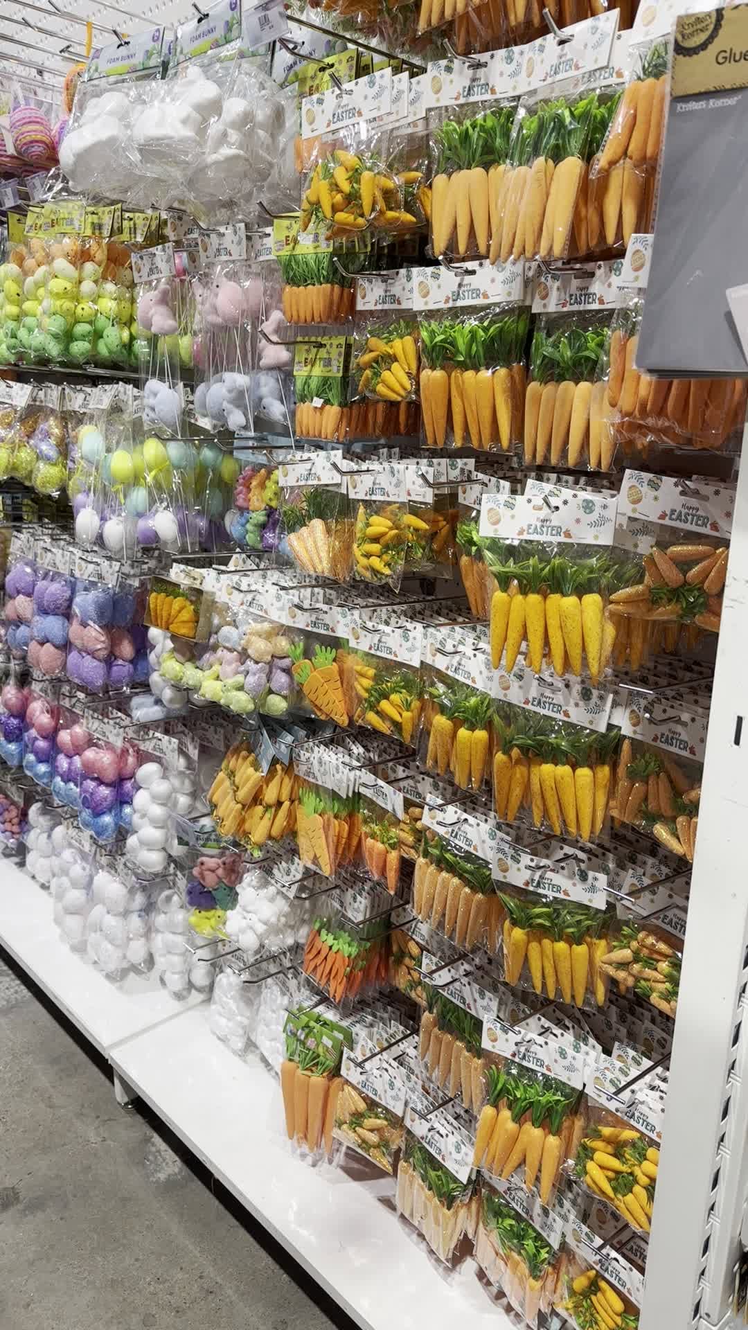 Colourful Easter craft supplies, foam decorations and seasonal craft items packed on store shelving